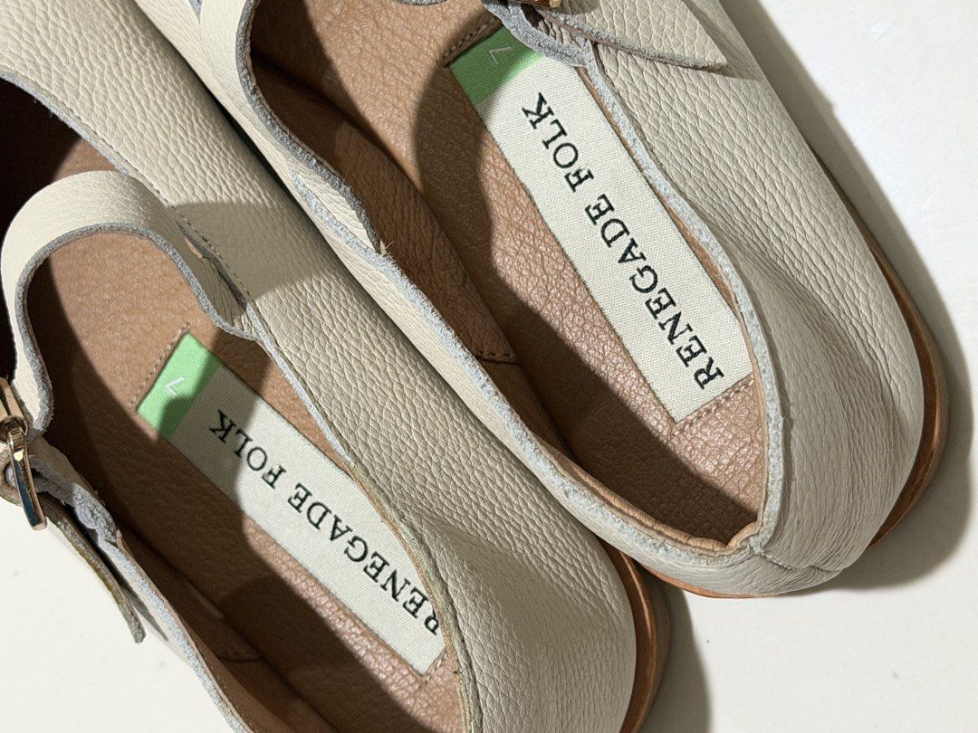 Renegade Folk Mary Janes (Category: Flats & Sandals) located in Bulacan. Submitted by arianecleansupcloset (Listing ID 1441594260, Image 3). Description: - Brand: Renegade Folk - Style: Mary Jane Shoes - Color: Cream - Material: Textured Leather - Features: T-strap with buckle closure - Condition: Soles show some wear - Ideal for: Comfortable and stylish everyday wear.