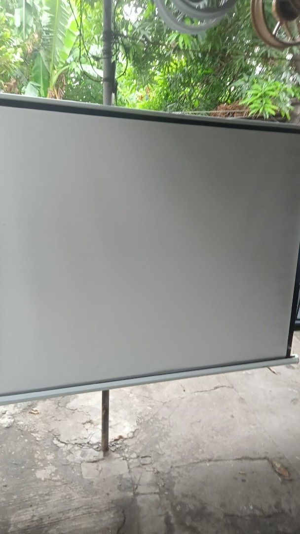 Retractable Projector Screen with Stand (Category: Projectors) located in Manila. Submitted by wisegem-231b (Listing ID 1441701624, Image 1). Description: - Retractable projector screen with easy-to-use stand - White screen surface: [insert width] x [insert height] - Ideal for presentations, home theater, and movie nights - Stand has minor scuffs, but screen is in clean condition - Ready for its next owner!.