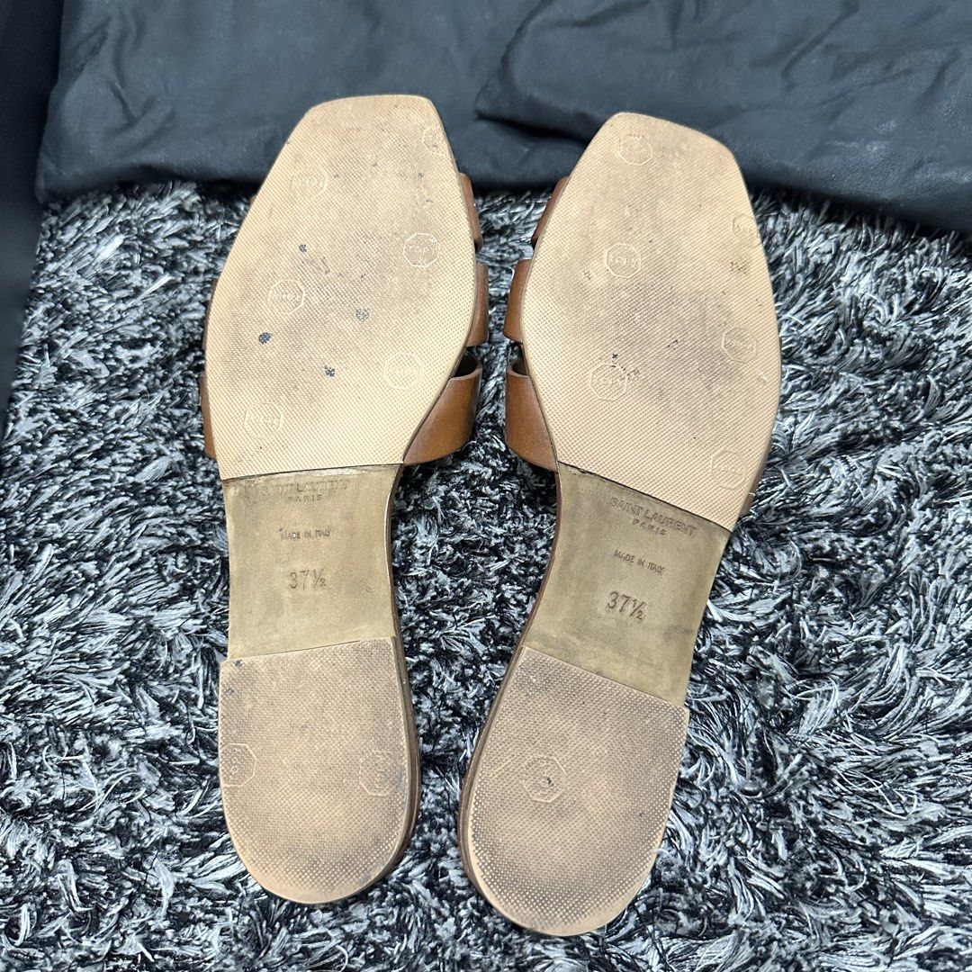 Saint Laurent Brown Woven Leather Flat Sandals (Category: Flats & Sandals) located in Manila. Submitted by natalyali (Listing ID 1441710588, Image 3). Description: - Brand: Saint Laurent - Type: Flat Sandals - Color: Brown - Size: 37.5 - Condition: Pre-loved (comes with dust bags and original box) - Features: Super comfy and stylish, perfect for everyday wear or dressing up..