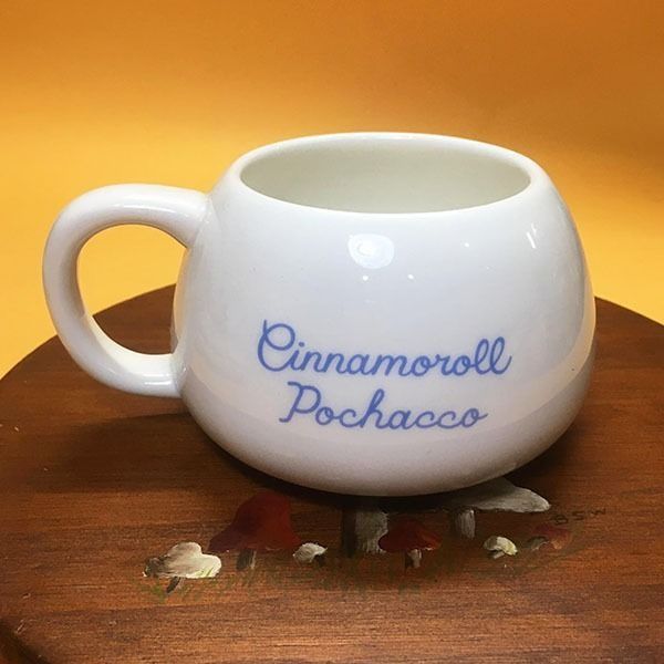Cinna*moroll Pochacco White Ceramic Mug (Category: Coffee & Tea Tableware) located in Mandaluyong City. Submitted by yula_noveltyfinds (Listing ID 1441590631, Image 2). Description: - Adorable white ceramic mug featuring Cinnamoroll - Playful, cartoonish design. - Authentic Sanrio product with logo and 2021 copyright. - Ideal for enjoying your favorite hot beverages. - A must-have for Sanrio fans! - good condition - can be repurposed as succulent