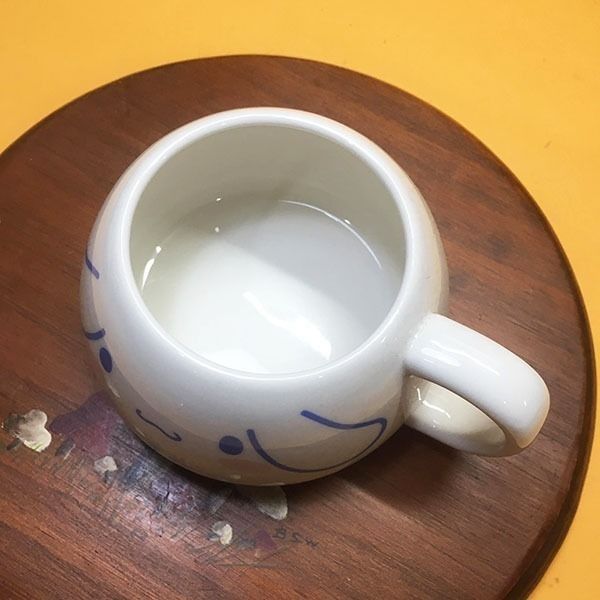 Cinna*moroll Pochacco White Ceramic Mug (Category: Coffee & Tea Tableware) located in Mandaluyong City. Submitted by yula_noveltyfinds (Listing ID 1441590631, Image 3). Description: - Adorable white ceramic mug featuring Cinnamoroll - Playful, cartoonish design. - Authentic Sanrio product with logo and 2021 copyright. - Ideal for enjoying your favorite hot beverages. - A must-have for Sanrio fans! - good condition - can be repurposed as succulent