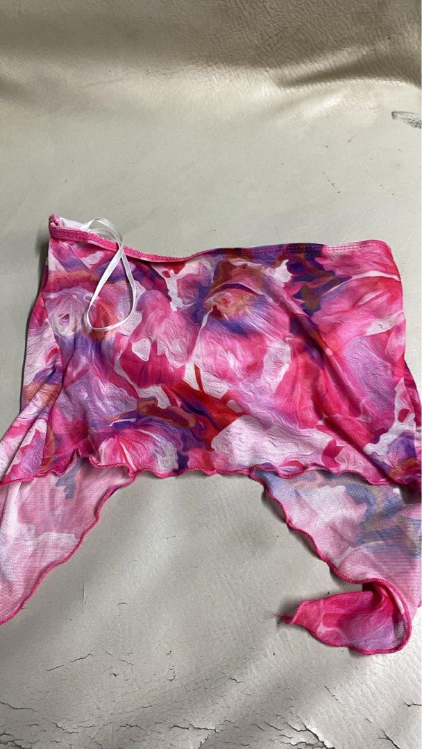 SHEIN Pink Floral Mesh Twist Front Halter Top Size S (Category: Sleeveless) located in Manila. Submitted by andy.cc (Listing ID 1441663194, Image 3). Description: - Cute pink and purple floral mesh top - Brand: SHEIN - Features: Twist front detail, halter neck tie - Perfect for layering or beachwear - Size: S.