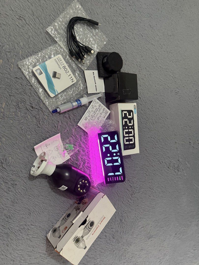 Smart Camera, Digital Clock, Mini Speaker, Heatsink (Category: Soundbars, Speakers & Amplifiers) located in Manila. Submitted by aimas05 (Listing ID 1441637286, Image 1). Description: - Smart Camera with Night Vision (new) - Digital Alarm Clock with LED Display & Pink Ambient Light (new) - Mini Bluetooth Speaker - Tube of Heatsink Compound (new) - Wi-Fi Adapter (new) - Various Cables (new) All items are in original packaging or appear unused. tak