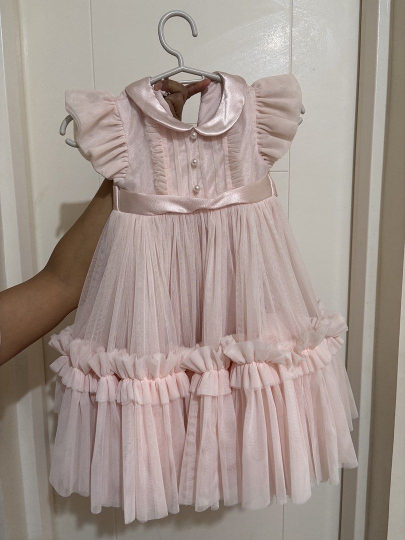 Spinkie Clara Tutu dress (Category: Dresses) located in Pasig City. Submitted by az1235 (Listing ID 1333231683, Image 2). Description: Bought for P4150 at Spinkie SM Megamall Used once (1st bday) No issues Size: 12-18 months Color: powder pink.