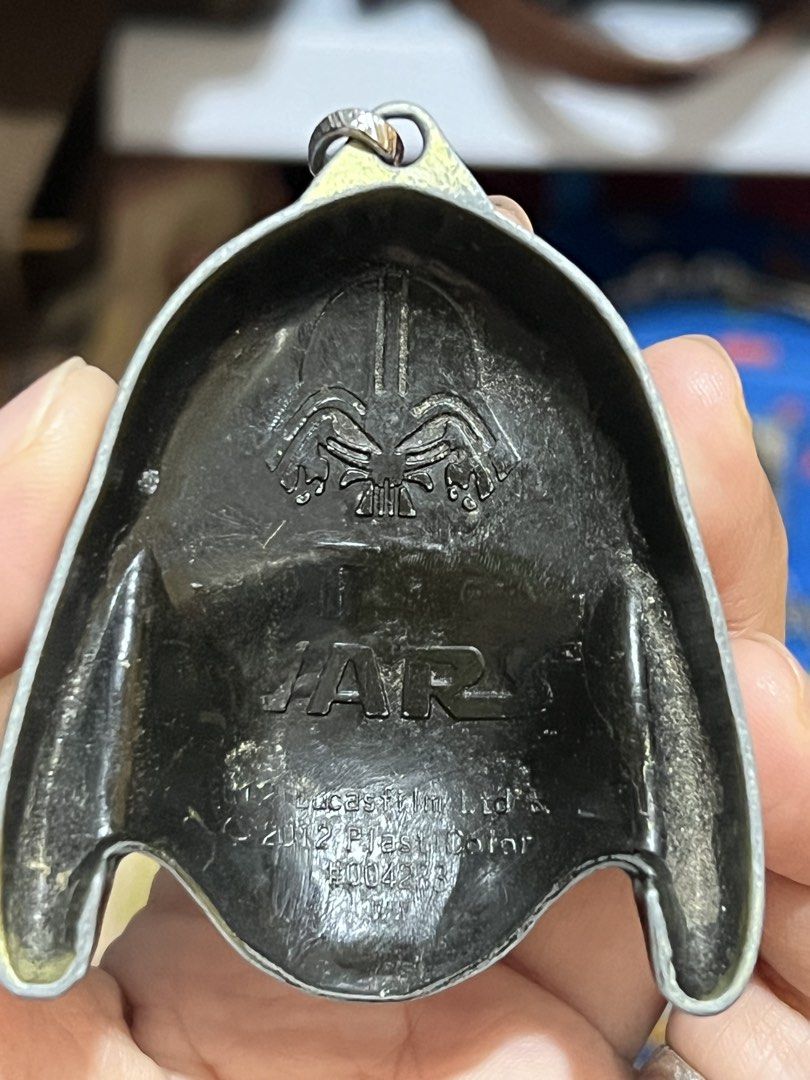 Star Wars Darth Vader helmet keychain, (Category: Western Merchandise) located in Rizal. Submitted by babamamanyingonlineshop (Listing ID 1441737836, Image 2). Description: 650 bronze-colored Star Wars Darth Vader helmet keychain, featuring a brushed metallic finish..