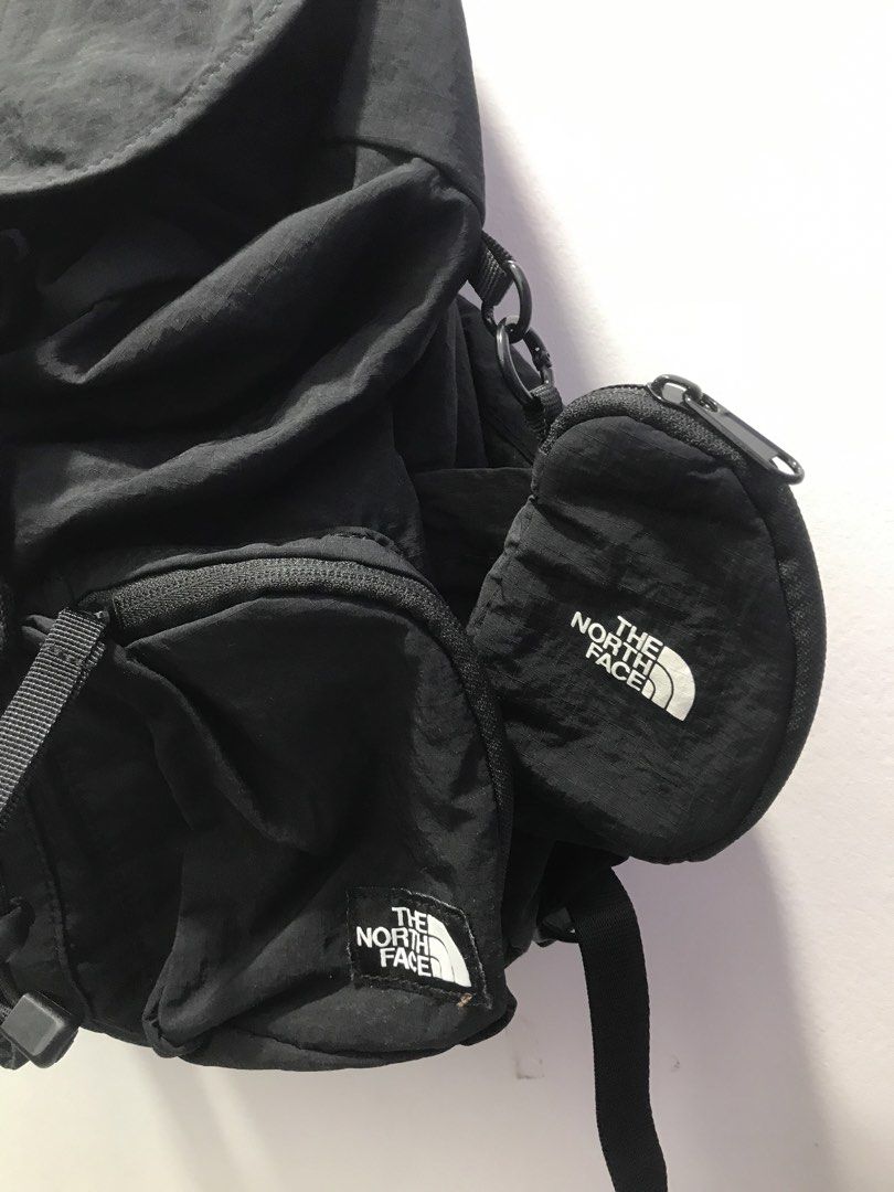 The North Face Black Backpack with Pouch (Category: Backpacks) located in Bamban. Submitted by ukaythriftedkoto (Listing ID 1441731474, Image 2). Description: - Brand: The North Face - Color: Black - Main compartment with drawstring and flap closure - Multiple front pockets for organization - Includes a small, detachable branded pouch on the side - Padded back straps for comfort - Perfect for everyday use, school, or travel.