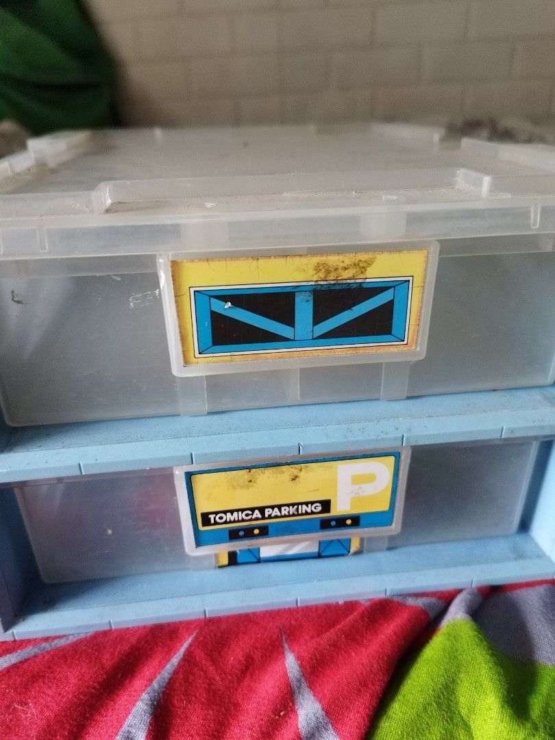 Tomica Parking 2-Tier Drawer Storage Box (Category: Storage Boxes & Baskets) located in Manila. Submitted by pickerjessie (Listing ID 1441607700, Image 2). Description: - Two-tier storage drawers (blue and clear plastic) - Labeled 'Tomica Parking' - Ideal for organizing small items (toys, craft supplies, etc.) - Drawers slide smoothly - Minor scuffs on labels.