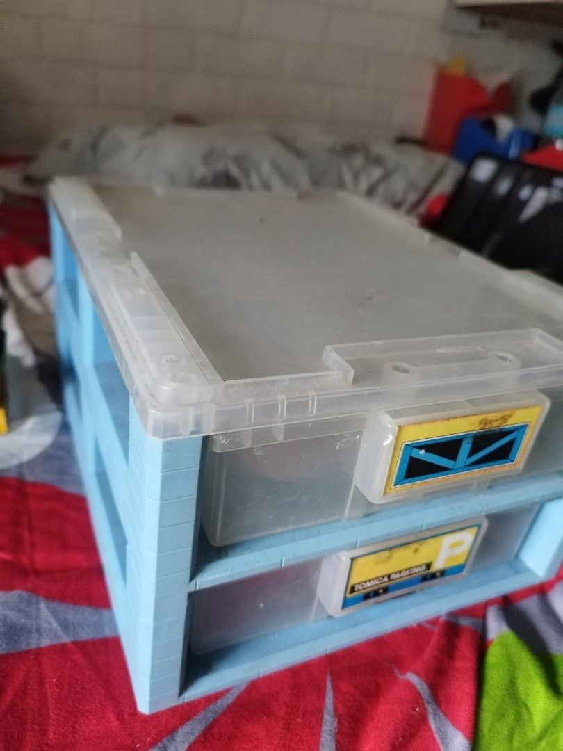 Tomica Parking 2-Tier Drawer Storage Box (Category: Storage Boxes & Baskets) located in Manila. Submitted by pickerjessie (Listing ID 1441607700, Image 1). Description: - Two-tier storage drawers (blue and clear plastic) - Labeled 'Tomica Parking' - Ideal for organizing small items (toys, craft supplies, etc.) - Drawers slide smoothly - Minor scuffs on labels.