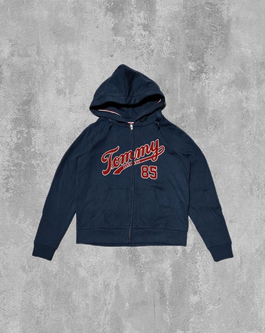 Tommy Hilfiger Full zip hoodie (Category: Hoodies) located in Maramag. Submitted by awatcil (Listing ID 1441719064, Image 1). Description: Tommy Hilfiger Full zip spell out hoodie W-21 L-24 Condition 9.4/10 Good as new Minimal Cracks (last pic) No other flaws.