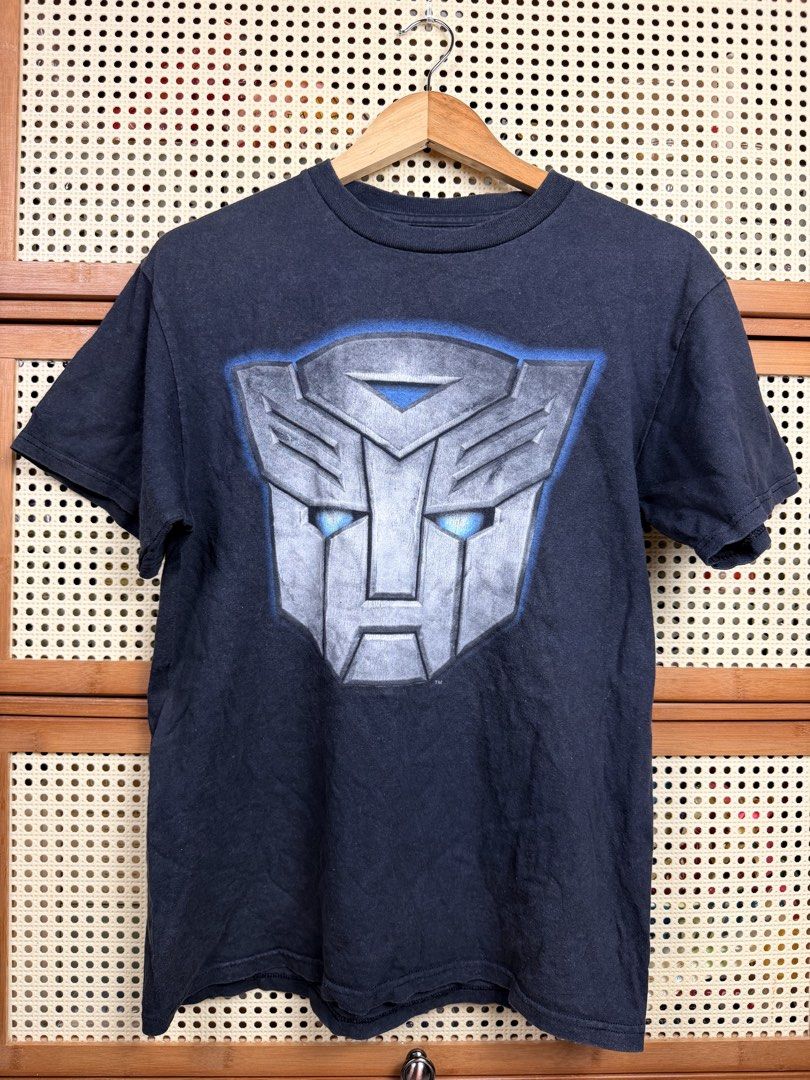 Transformers (Category: Tshirts & Polo Shirts) located in Kuala Lumpur. Submitted by him.her.thrift (Listing ID 1441726011, Image 1). Description: Transformers 19.5 x 27 Sz s Condition 8/10 ( ada pinhole) Price Rm 10 Pos bayar jnt Beli 2 barang dalam senarai gred postage.