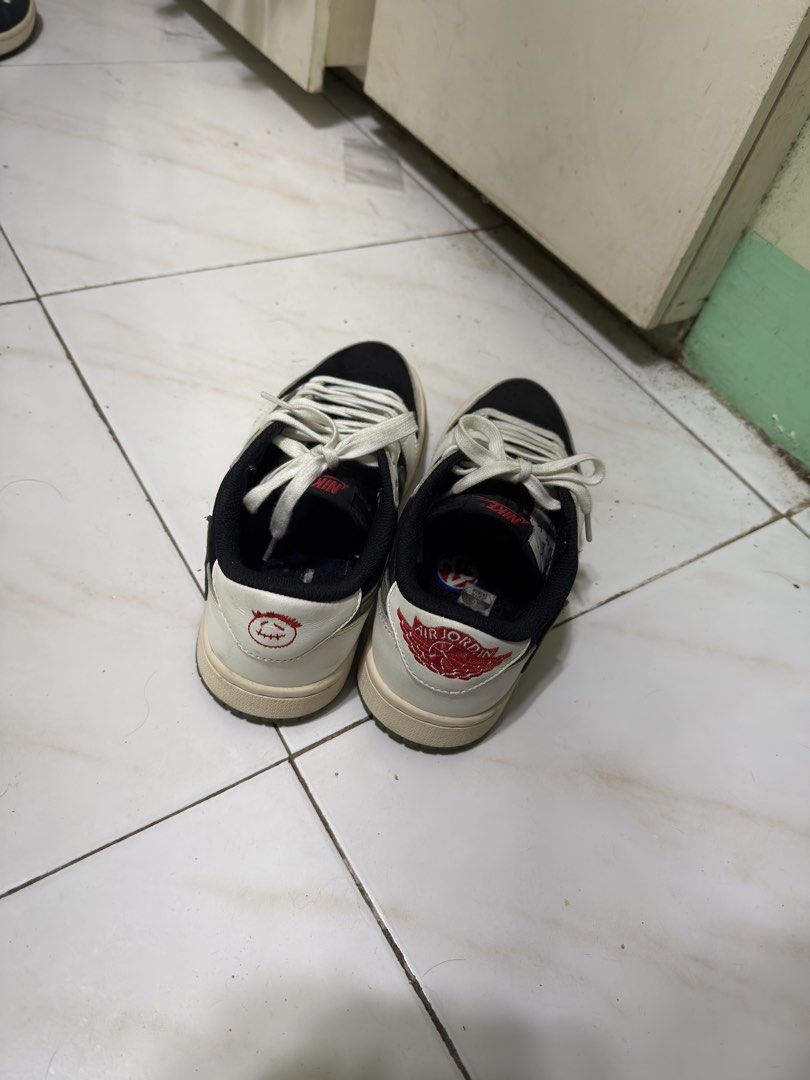Travis Scott x Air Jordan 1 Low OG (Category: Sneakers) located in Manila. Submitted by calmtiger-6d6d (Listing ID 1441776375, Image 2). Description: - Travis Scott x Air Jordan 1 Low OG - Classic Black and White colorway - Iconic reverse Swoosh design - Cactus Jack branding on the heel - Must-have for any sneaker enthusiast's collection.