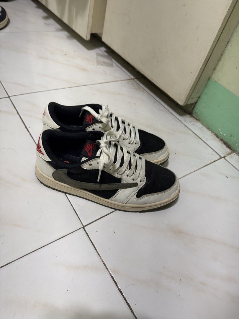 Travis Scott x Air Jordan 1 Low OG (Category: Sneakers) located in Manila. Submitted by calmtiger-6d6d (Listing ID 1441776375, Image 3). Description: - Travis Scott x Air Jordan 1 Low OG - Classic Black and White colorway - Iconic reverse Swoosh design - Cactus Jack branding on the heel - Must-have for any sneaker enthusiast's collection.