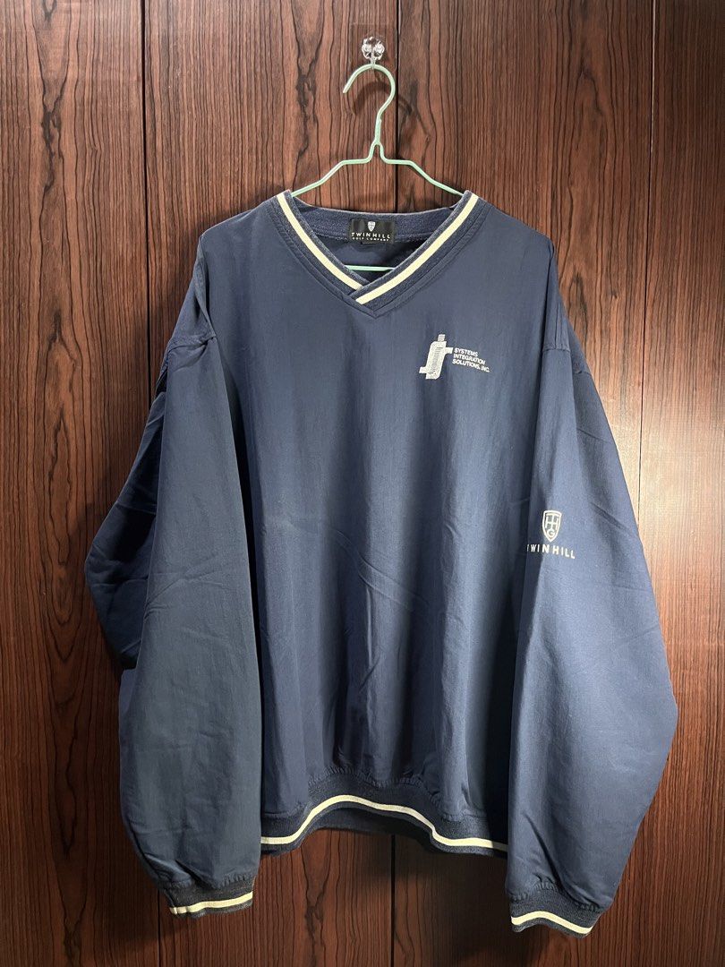 Twin Hill Golf Company Navy V-Neck Pullover (Category: Coats, Jackets and Outerwear) located in Manila. Submitted by chiyooo787 (Listing ID 1441756293, Image 1). Description: 27L by 25W Brand: Twinn Hill Golf Company Color rate: 8/10 Issue: slight discoloration on cuffs but not super noticeable - Navy blue pullover from Twin Hill Golf Company - V-neck with white trim - Logo on left chest and sleeve - Side pockets included - Ideal for golf or casu