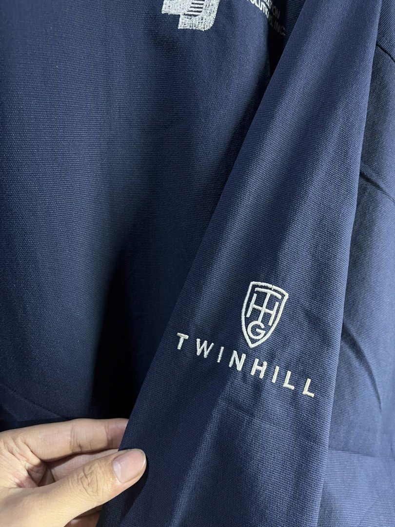 Twin Hill Golf Company Navy V-Neck Pullover (Category: Coats, Jackets and Outerwear) located in Manila. Submitted by chiyooo787 (Listing ID 1441756293, Image 3). Description: 27L by 25W Brand: Twinn Hill Golf Company Color rate: 8/10 Issue: slight discoloration on cuffs but not super noticeable - Navy blue pullover from Twin Hill Golf Company - V-neck with white trim - Logo on left chest and sleeve - Side pockets included - Ideal for golf or casu