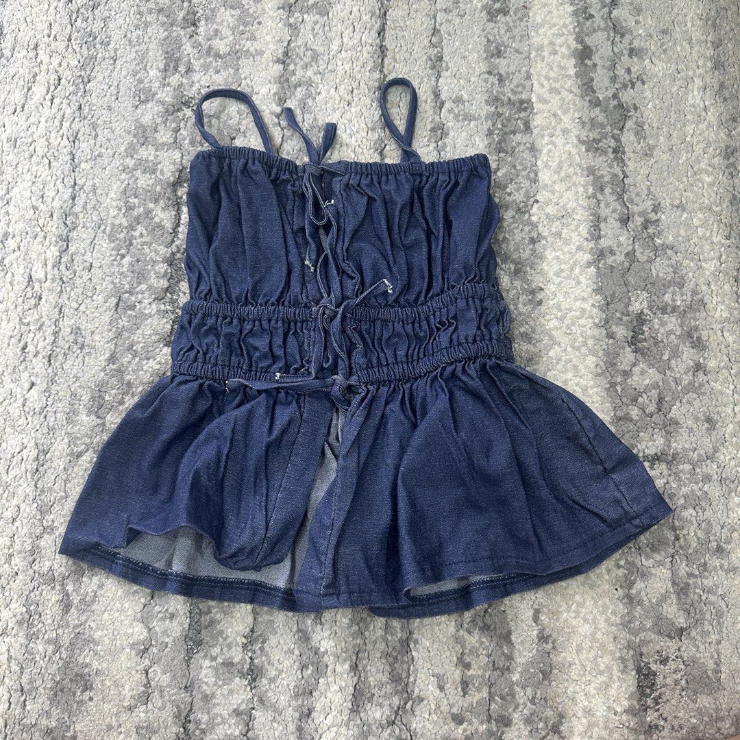 UFA by NED Denim Corset Top (Category: Sleeveless) located in Quezon City. Submitted by _cc_declutters (Listing ID 1441666693, Image 1). Description: - Cute denim top from UFA by NED - Features a ruched bodice with a lace-up front - Elasticated waistband for a comfy fit - Skirt part flares out - Versatile for casual day or night out.