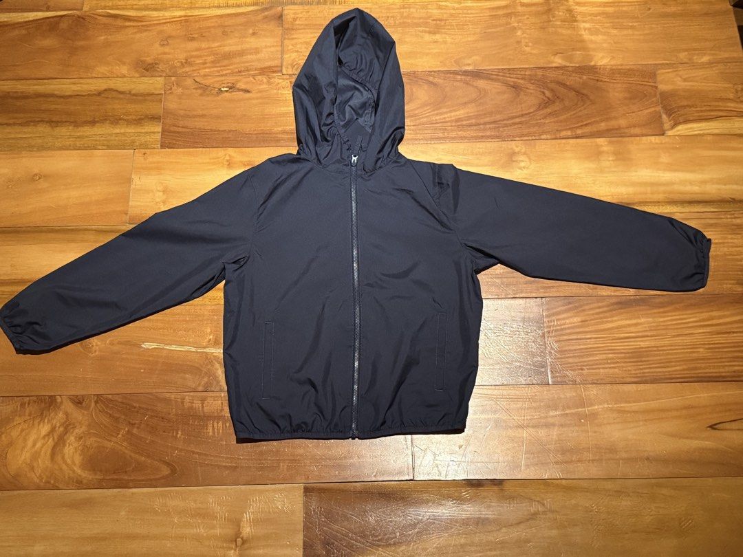 Uniqlo Pocketable Parka Navy Blue Kids Size 140 (Category: Babies & Kids Fashion) located in Pateros City. Submitted by eunikaesp92479 (Listing ID 1441750869, Image 1). Description: - Uniqlo Navy Blue Pocketable Parka Jacket - Size 140 - Lightweight and folds up small for easy packing - Ideal for light rain and wind protection - Features a full zip front and a hood - Includes two side pockets - Versatile for everyday wear or travel.