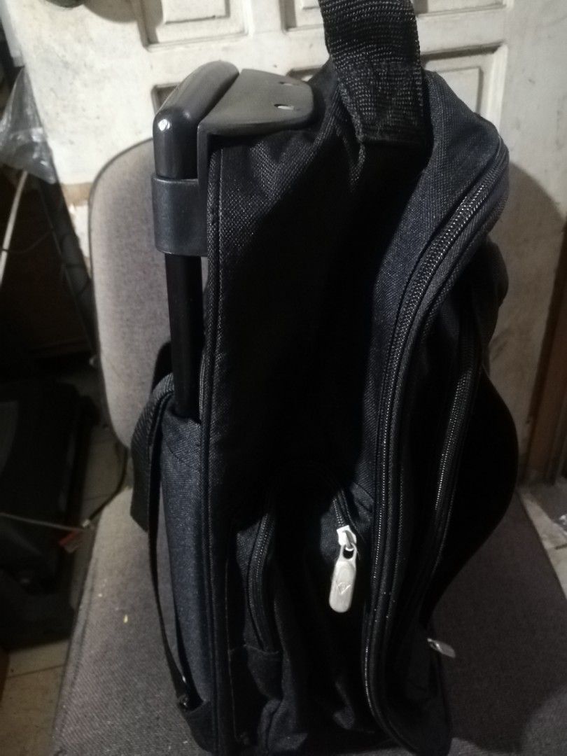 vintage 2wheeled dunlop trolley bag (back pack) (Category: Backpacks) located in Paranaque City. Submitted by 4thestate.surplusan (Listing ID 1441686143, Image 2). Description: dunlop two wheeled trolley bag. 44x 30x 18cm. no issue..