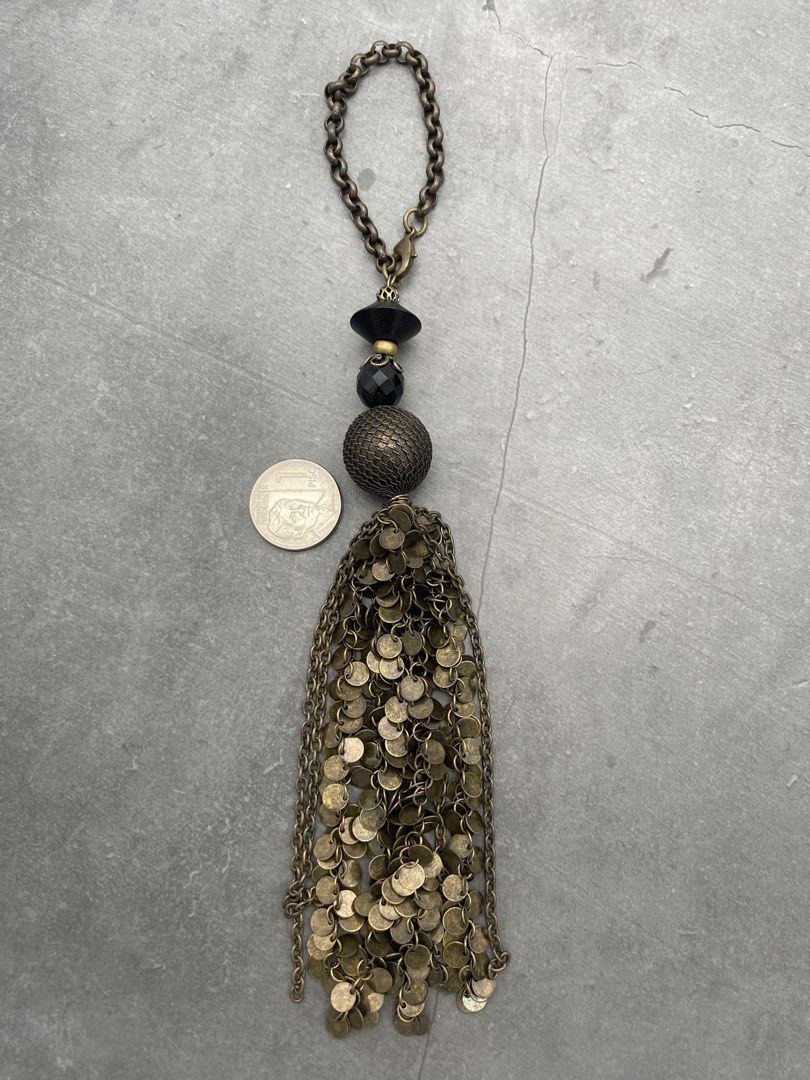 Vintage bag charm from Japan (Category: Other Accessories) located in Quezon City. Submitted by vintagebymatilde (Listing ID 1441774504, Image 3). Description: ⚜️Vintage tassel bag charm. Black and antique metal finish. 7.5” drop length. Length 6”. Has weight. Sourced from Tokyo. For all our vintage pieces: please read Disclaimer It will be sold as is. All sales are final. No return. No exchange. Please inspect the photo before purchasing. Thank 