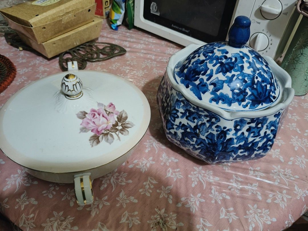 Vintage Ceramic Serving Bowls with Lids - Floral & Blue White (Category: Dinnerware & Cutlery) located in Marikina City. Submitted by lorence11 (Listing ID 1441663751, Image 1). Description: - Set of 2 ceramic serving bowls with decorative lids. - One bowl features a WHITE COLOR - The other bowl has a blue and white floral pattern. - Both bowls include handles for easy carrying. - Lids are decorative and add to the vintage aesthetic. - Ideal for 