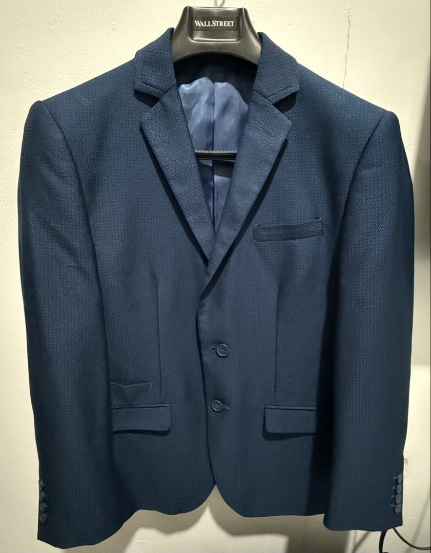 Wall Street Navy Blue Textured Suit (Category: Coats, Jackets and Outerwear) located in San Pedro. Submitted by me-shops (Listing ID 1441693560, Image 1). Description: For rent: 1k with security deposit Navy blue Suit with pants Brand: Wall Stree Size: Fits Medium to Large location: Muntinlupa - Textured fabric all over - Two-button closure - Chest pocket - Two flap pockets at the front - Fully lined interior with inner pockets - Ideal for formal