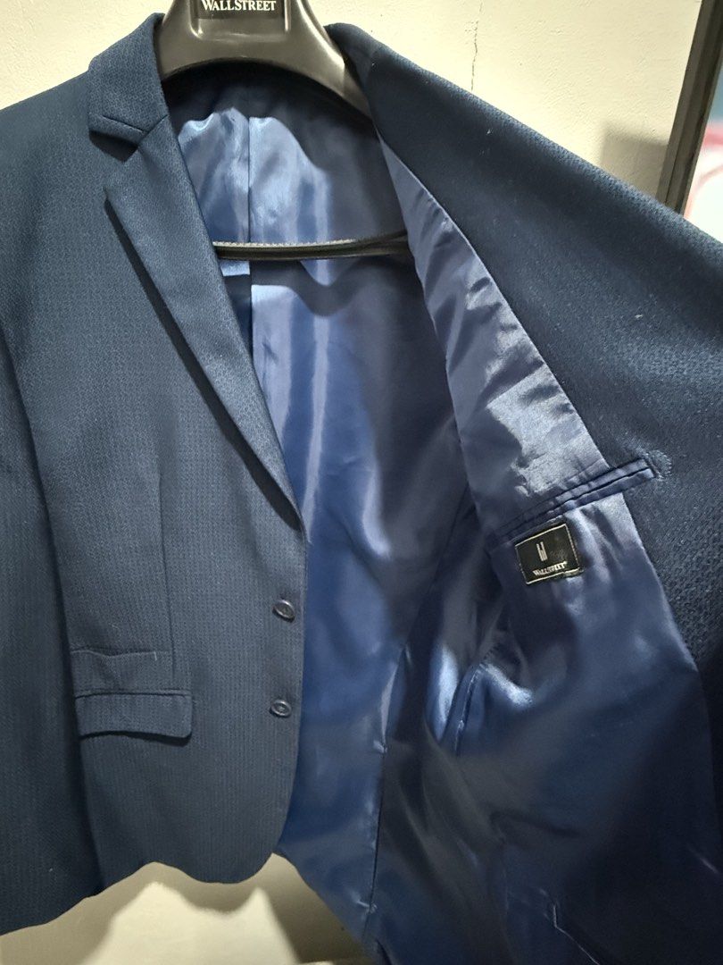 Wall Street Navy Blue Textured Suit (Category: Coats, Jackets and Outerwear) located in San Pedro. Submitted by me-shops (Listing ID 1441693560, Image 3). Description: For rent: 1k with security deposit Navy blue Suit with pants Brand: Wall Stree Size: Fits Medium to Large location: Muntinlupa - Textured fabric all over - Two-button closure - Chest pocket - Two flap pockets at the front - Fully lined interior with inner pockets - Ideal for formal