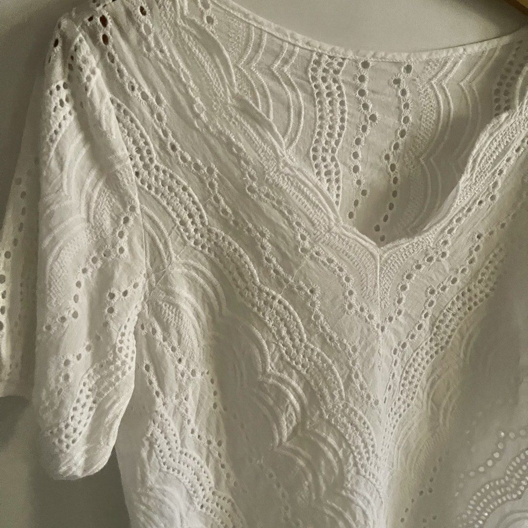 White Eyelet V-Neck Short Sleeve Top (Category: Blouses) located in General Trias. Submitted by 1992thelabel (Listing ID 1441650755, Image 2). Description: - Chic white short sleeve top - Flattering V-neckline - All-over eyelet detailing for a touch of elegance - Stylish slightly puffed sleeves - Breathable and comfortable fabric - Versatile for casual or dressed-up looks.