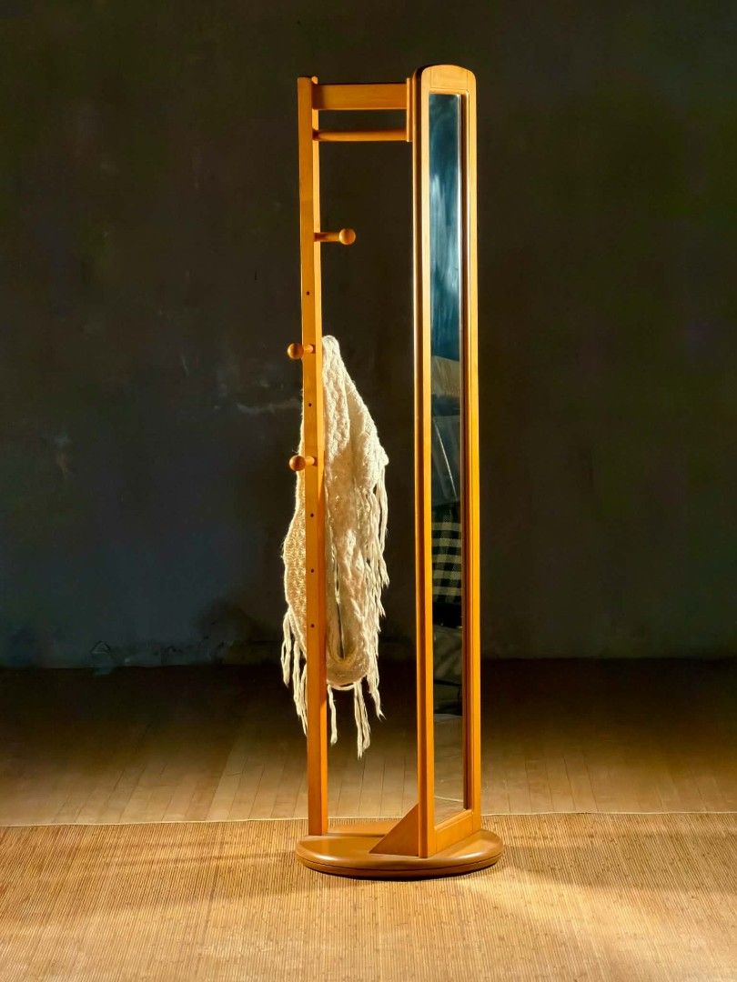 Wooden Coat Rack with Full Length Mirror (Category: Mirrors) located in Valenzuela. Submitted by upcycle_things (Listing ID 1441698658, Image 3). Description: - Wooden coat rack with a tall, slim full-length mirror. - Multiple hooks for convenient hanging of clothes and accessories. - Stable round base for secure placement. - Ideal for entryways, bedrooms, or any space needing style and function..