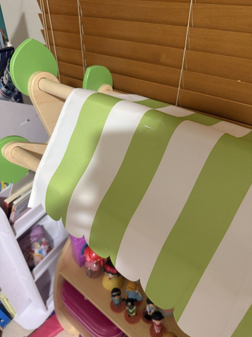 Wooden open shelf toy storage with Canopy (Category: Shelves, Cabinets & Racks) located in Makati City. Submitted by thegarmentcloud (Listing ID 1441598503, Image 3). Description: -hard wood, high quality item -brand: THINKING TOYS - Adorable wooden play stand - Features a charming green and white striped canopy - Perfect for sparking imaginative play - best condition -TOYS ARE NOT INCLUDED.