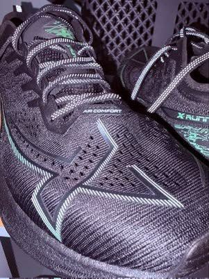 Xtep One Piece Modeling 3.0 - Black Green (Category: Sneakers) located in Pasig City. Submitted by entertrou (Listing ID 1441778939, Image 3). Description: - Brand: XTEP - Color: Black with Neon Green accents - Material: Lightweight and breathable mesh upper - Features: Reflective details on laces and heel - Ideal for: Running.