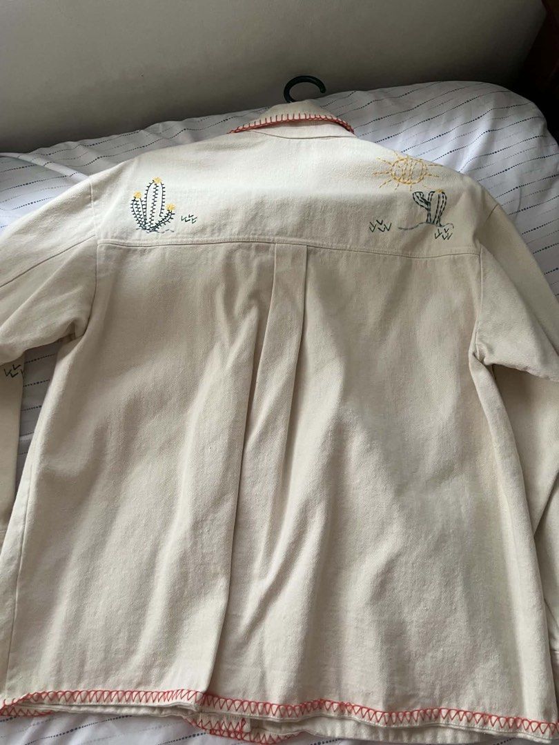 ZARA Embroidered Desert Scene Denim Jacket (Category: Coats, Jackets and Outerwear) located in Mandaluyong City. Submitted by chelzeee (Listing ID 1441637625, Image 2). Description: Jacket with embroidered details 24x26.