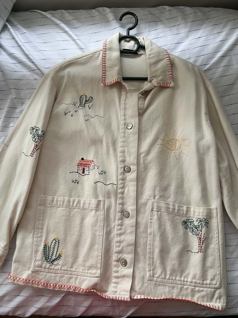 ZARA Embroidered Desert Scene Denim Jacket (Category: Coats, Jackets and Outerwear) located in Mandaluyong City. Submitted by chelzeee (Listing ID 1441637625, Image 1). Description: Jacket with embroidered details 24x26.