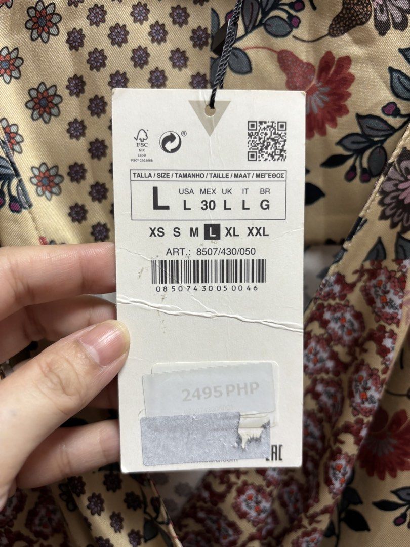 Zara Patchwork Floral Wrap Dress Size L (Category: Dresses) located in Malabon City. Submitted by thriftymanoy (Listing ID 1441637158, Image 3). Description: - Zara Wrap Dress - Size: L - Print: Patchwork Floral - Features: Tie waist, long sleeves, side zipper closure - Fabric: Slight sheen - Style: Dress up or down, versatile.