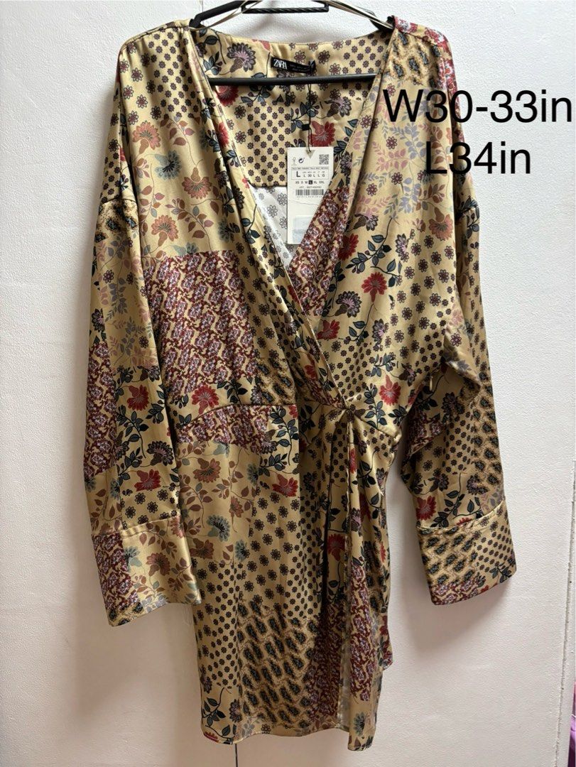 Zara Patchwork Floral Wrap Dress Size L (Category: Dresses) located in Malabon City. Submitted by thriftymanoy (Listing ID 1441637158, Image 1). Description: - Zara Wrap Dress - Size: L - Print: Patchwork Floral - Features: Tie waist, long sleeves, side zipper closure - Fabric: Slight sheen - Style: Dress up or down, versatile.