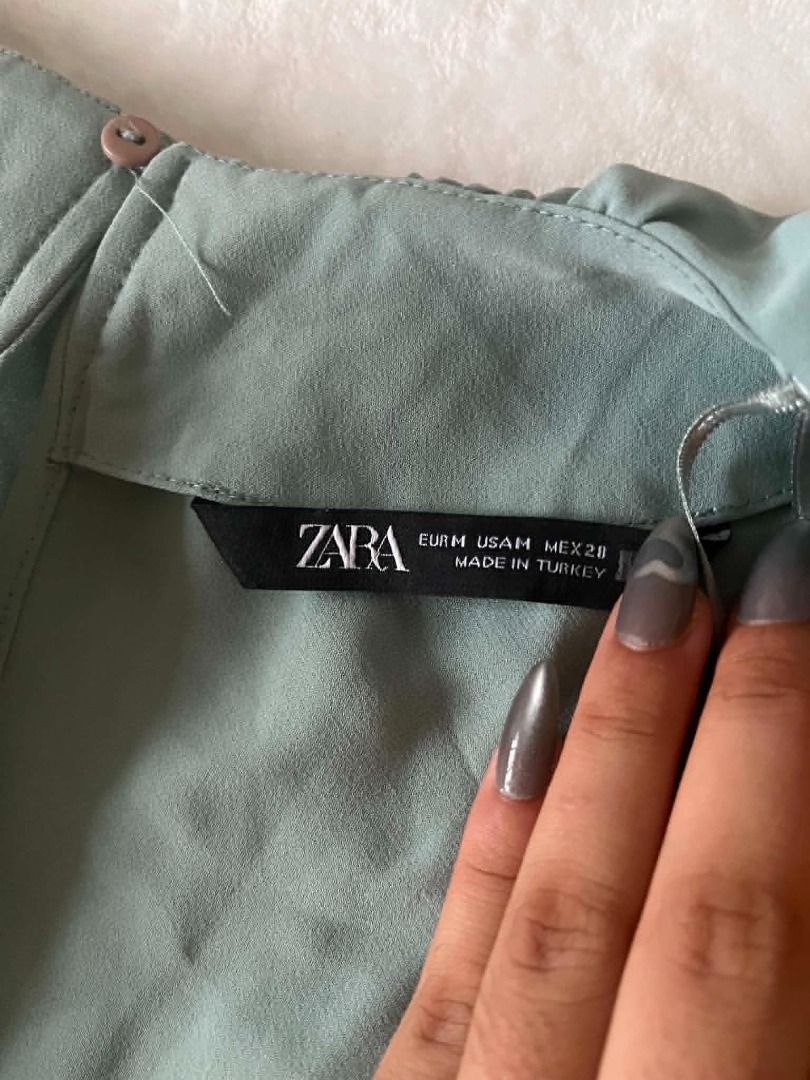 Zara sage green jumpsuit (Category: Jumpsuits) located in Pasig City. Submitted by closet_reframe (Listing ID 1441615095, Image 3). Description: Worn once, flows nice. no visible issues, quality is good. very elegant. Bag and shoes are also for sale! S: M.