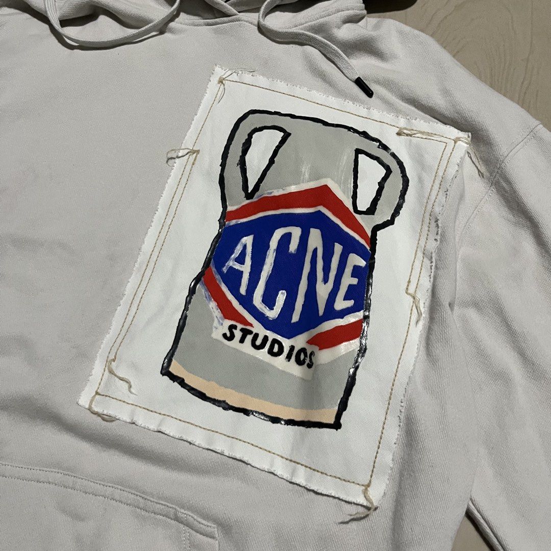 Acne Studios Ceramic Patch Hooded Sweatshirt (Category: Coats, Jackets and Outerwear) located in Lucena. Submitted by brkrobert (Listing ID 1446815248, Image 2). Description: - White Acne Studios hoodie - Unique hand-painted Acne Studios logo patch on chest - Drawstring hood - Front pocket - Ideal for casual wear - xs - medium - minimal stains front i think unnoticeable naman sya when worn - excellent panaman condition overall sobrang sikip pa ri