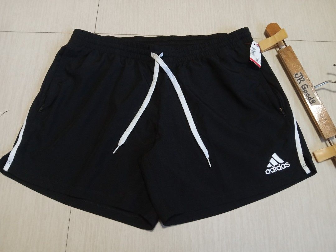 Adidas Black Shorts with White Stripes (Category: Activewear) located in Tanay. Submitted by jrgoods (Listing ID 1446796352, Image 3). Description: ADIDAS running Large above the knee Waistline 34-36 length 14.5 Good as new condition 599+ship Tanay Rizal location Shipping Nationwide - White side stripes - Elastic waistband with drawstring - Zippered pockets - Comfortable material - Ideal for sports or casual wear.