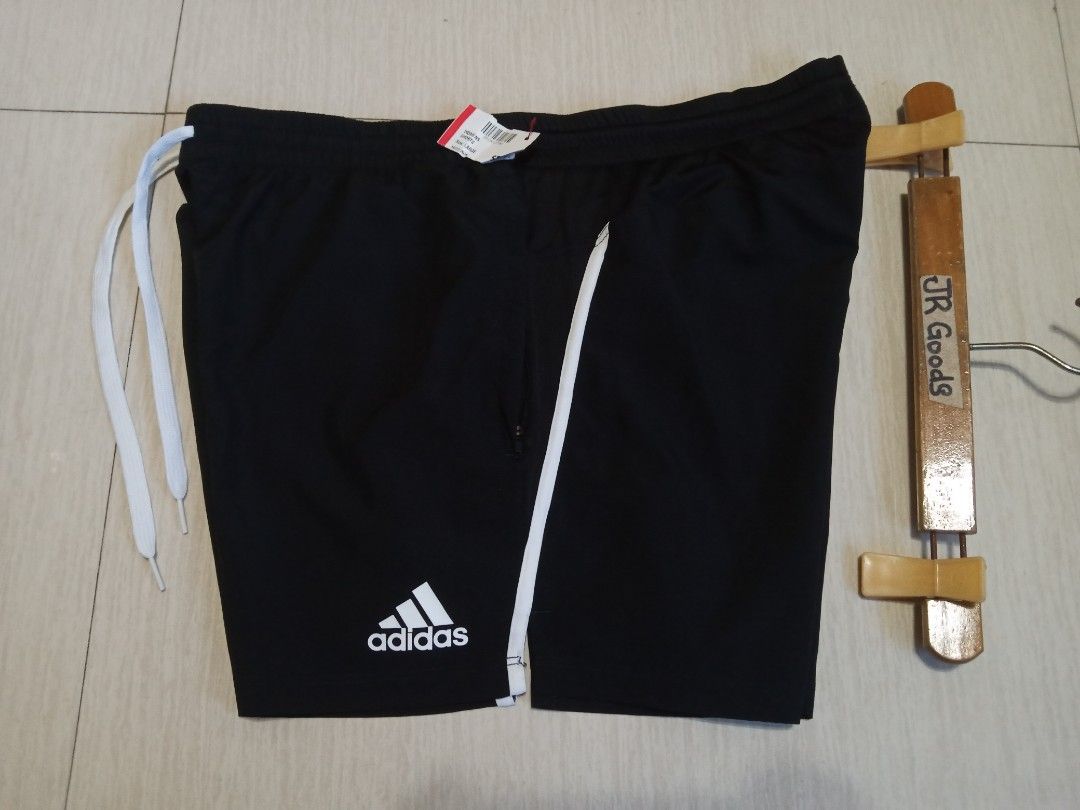 Adidas Black Shorts with White Stripes (Category: Activewear) located in Tanay. Submitted by jrgoods (Listing ID 1446796352, Image 1). Description: ADIDAS running Large above the knee Waistline 34-36 length 14.5 Good as new condition 599+ship Tanay Rizal location Shipping Nationwide - White side stripes - Elastic waistband with drawstring - Zippered pockets - Comfortable material - Ideal for sports or casual wear.