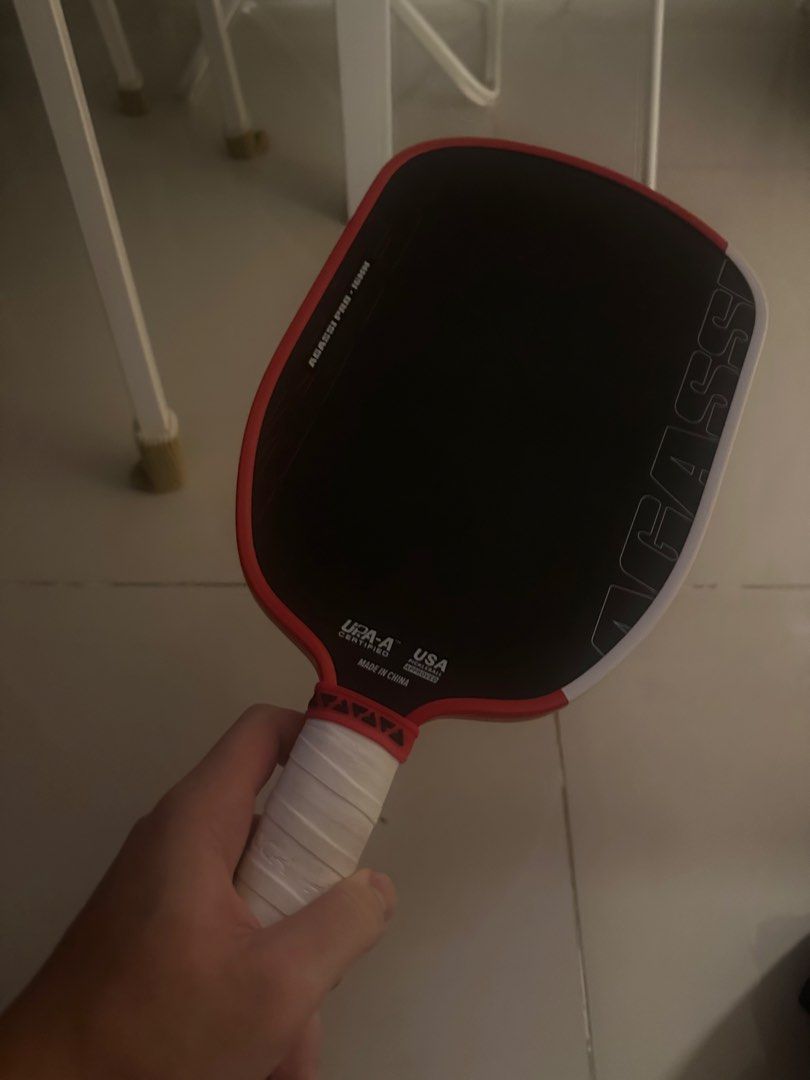 AGASSI PRO Pickleball Paddle (Category: Racket and Ball Sports) located in Quezon City. Submitted by micorgi (Listing ID 1446889769, Image 1). Description: - Agassi Pro pickleball paddle -Slightly Used - Striking red and black design - Comfortable white grip tape - Made in China - Ideal for playing pickleball.