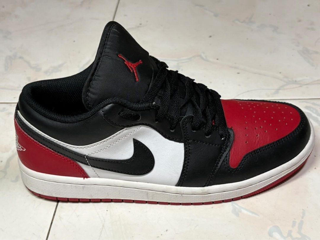 Air Jordan 1 Low "Chicago" Black Red White (Category: Sneakers) located in Santa Rosa. Submitted by colde (Listing ID 1446865231, Image 2). Description: - Classic Air Jordan 1 Low Chicago colorway - Black, red, and white leather construction - Iconic silhouette - Essential addition to any sneaker collection - Size: US 8 (26cm).