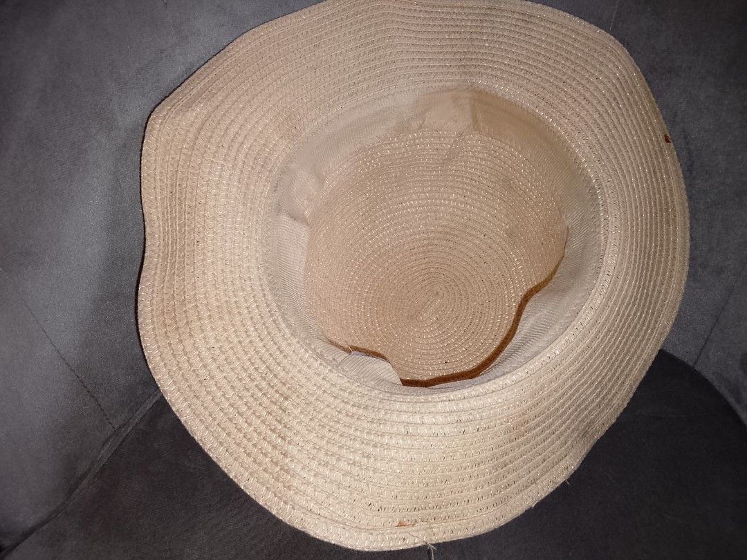ALDO Straw Hat with Ribbon Detail (Category: Hats & Beanies) located in Binangonan. Submitted by yuristalin888 (Listing ID 1446743203, Image 3). Description: - Brand: Aldo - Color: Beige - Design: Woven texture with a red and blue striped ribbon around the crown - Brim: Wide brim for sun protection - Occasion: Ideal for sunny days, keeping you cool and stylish.