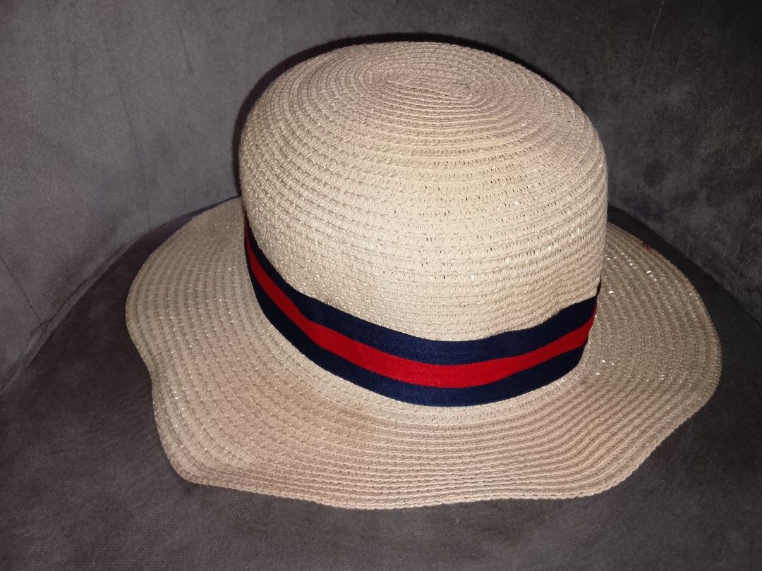 ALDO Straw Hat with Ribbon Detail (Category: Hats & Beanies) located in Binangonan. Submitted by yuristalin888 (Listing ID 1446743203, Image 1). Description: - Brand: Aldo - Color: Beige - Design: Woven texture with a red and blue striped ribbon around the crown - Brim: Wide brim for sun protection - Occasion: Ideal for sunny days, keeping you cool and stylish.