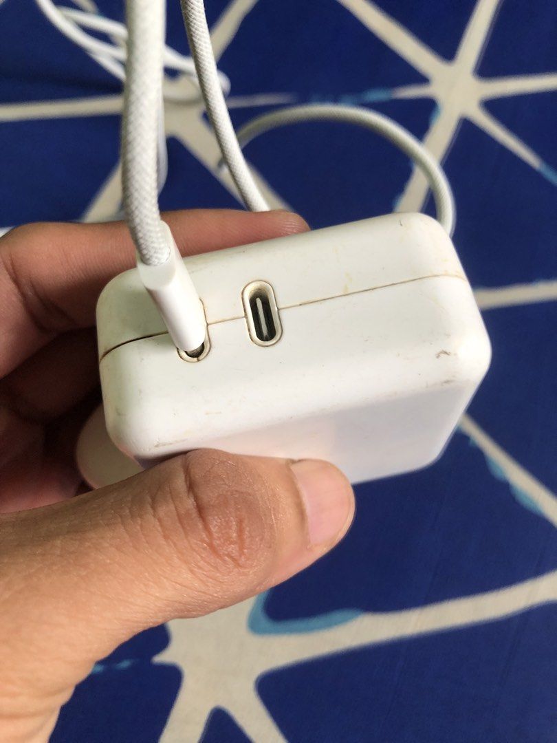 Apple 35W dual type C power adapter (Category: Chargers & Cables) located in Quezon City. Submitted by markgolveo (Listing ID 1446742278, Image 3). Description: Apple 35W dual type C power adapter Tested both type c ports working properly fast charging Signs of wears on outer shell.