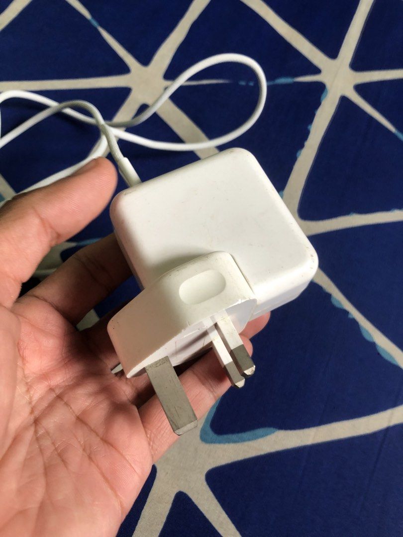 Apple 35W dual type C power adapter (Category: Chargers & Cables) located in Quezon City. Submitted by markgolveo (Listing ID 1446742278, Image 2). Description: Apple 35W dual type C power adapter Tested both type c ports working properly fast charging Signs of wears on outer shell.