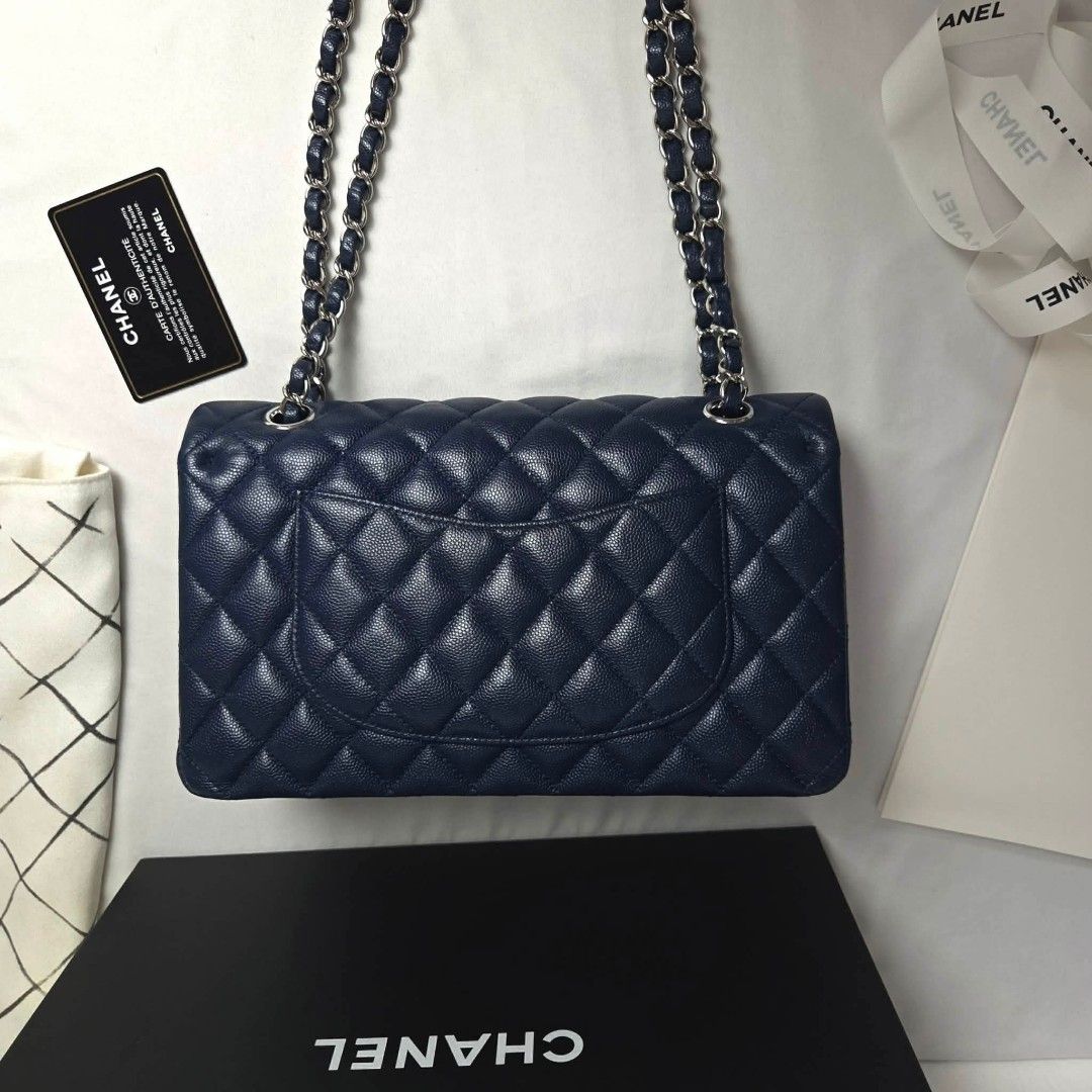 Authentic Chanel classic medium Navy Caviar s24 (Category: Luxury Bags & Wallets) located in Marikina City. Submitted by aussiemaan (Listing ID 1434044181, Image 3). Description: classic medium navy Caviar series24💞 6.30 card dust box booklet almost new rank SA Free pabitbit Korea - fully paid before paship Pinas.