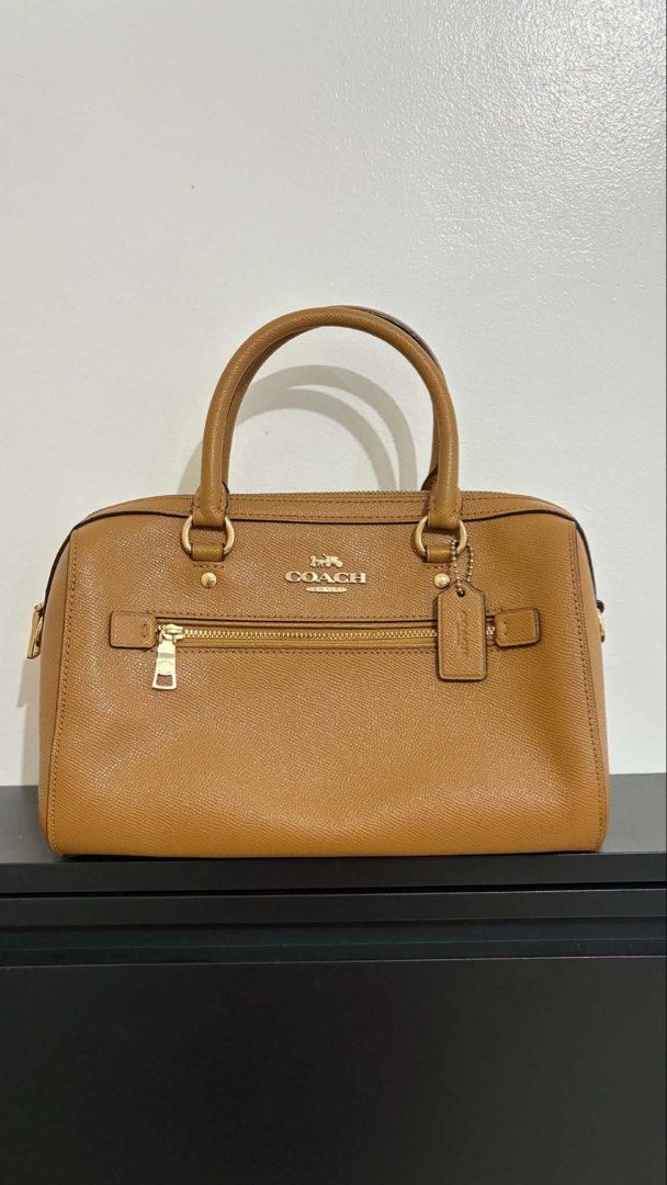 AUTHENTIC Coach Rowan Bag (Category: Luxury Bags & Wallets) located in Manila. Submitted by camziyah (Listing ID 1446905012, Image 1). Description: Own item, not a resell - comes with a leather strap and dust bag minor issue: stripping creed (bakbak) Slightly negotiable (NO lowballing) Feel free to ask for more pictures. .