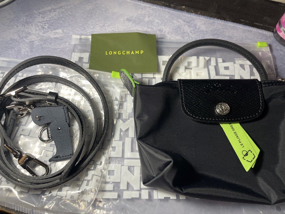AUTHENTIC LONGCHAMP LE PLIAGE GREEN POUCH W/ HANDLE (BLACK) (Category: Shoulder Bags) located in Bauang. Submitted by doc_jay01 (Listing ID 1446832355, Image 1). Description: ORIGINAL/AUTHENTIC BRAND NEW/NEVER USED BOUGHT FROM LONDON SRP: 6,000 (85 EURO) PRICE: 4,499 SLIGHTLY NEGOTIABLE J&T/LBC AT BUYER’S EXPENSE LBC COD AVAILABLE (DP 50%) PM FOR MORE DETAILS.