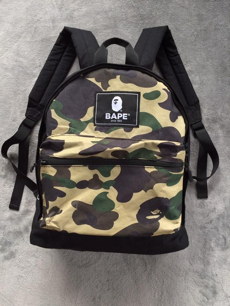 BAPE 1st Camo Backpack (Category: Backpacks) located in Manila. Submitted by niggzreyno51476 (Listing ID 1446789235, Image 2). Description: - Iconic BAPE 1st camo pattern - Front zip compartment for easy access - Comfortable padded shoulder straps - Signature BAPE logo patch - Made from durable canvas material - Ideal for everyday use and carrying your essentials.