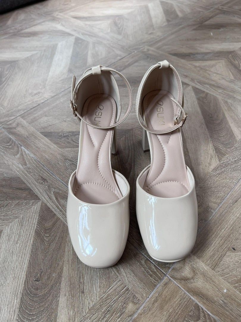 Beige Patent Ankle Strap Block Heels (Category: Heels) located in Quezon City. Submitted by paulinegat (Listing ID 1446779030, Image 3). Description: Selling a pair of beige patent heels. These have an ankle strap with a buckle closure. The block heel is about 2.5 inches high. Worn 2x. They come in their original box. RFS: Decluttering..