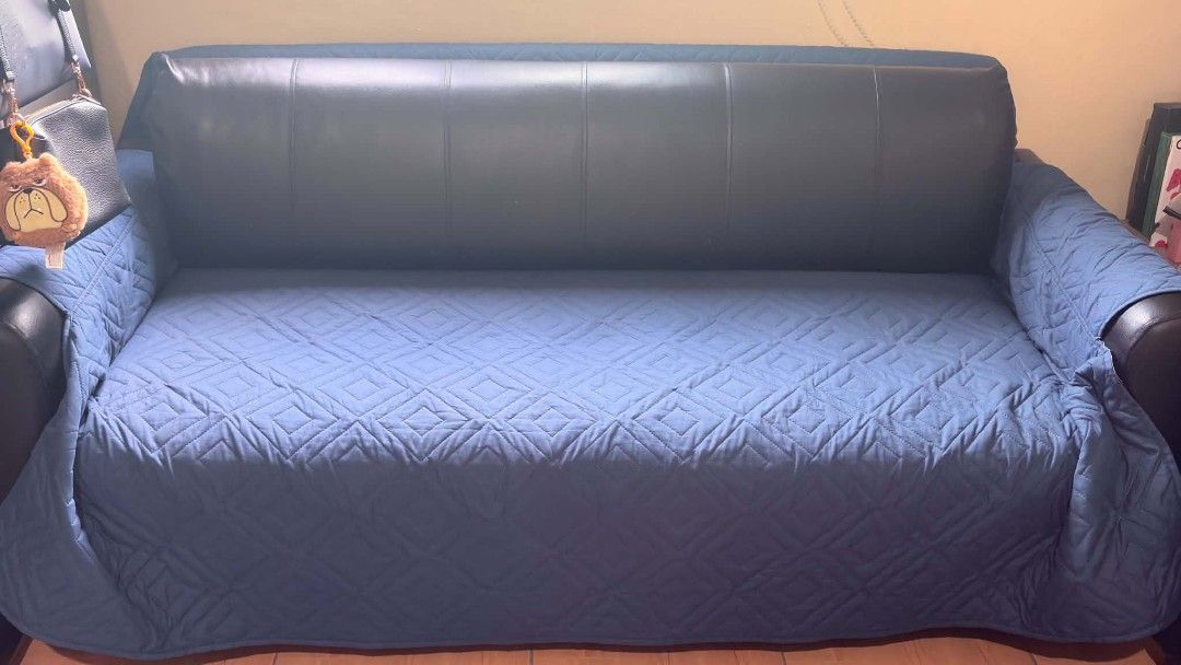 Black Leather Sofa with Blue Quilted Covers (Category: Sofas) located in Makati City. Submitted by breispreloved (Listing ID 1446779328, Image 3). Description: - Black leather sofa - Includes removable blue quilted seat and arm covers - Covers feature a stylish diamond pattern - Protects sofa from spills and everyday wear - Helps maintain a neat and tidy living room - Easy to put on and take off - can be converted to sofabed, jusy remove the long