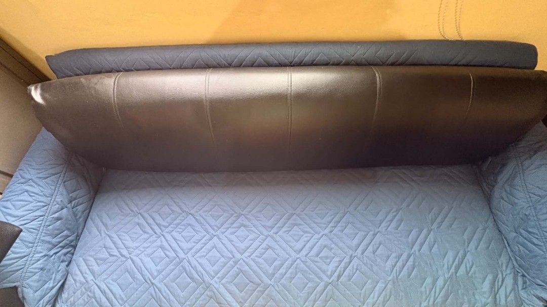 Black Leather Sofa with Blue Quilted Covers (Category: Sofas) located in Makati City. Submitted by breispreloved (Listing ID 1446779328, Image 2). Description: - Black leather sofa - Includes removable blue quilted seat and arm covers - Covers feature a stylish diamond pattern - Protects sofa from spills and everyday wear - Helps maintain a neat and tidy living room - Easy to put on and take off - can be converted to sofabed, jusy remove the long